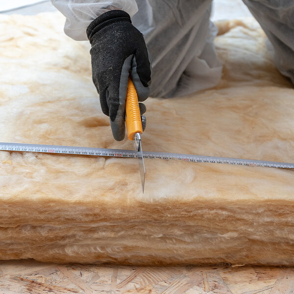 worker measuring the insulation